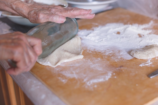 Hands preparing dough